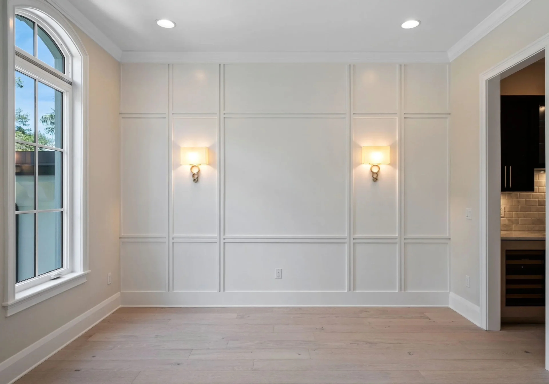 A room with white walls and light fixtures.